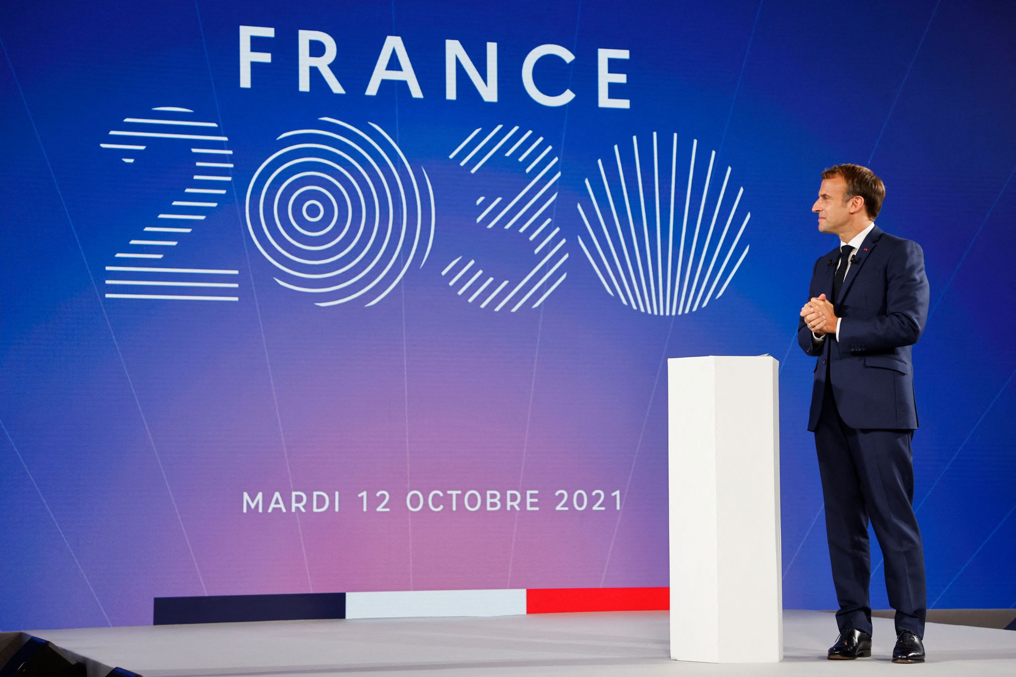 France's President Emmanuel Macron gestures as he speaks during the presentation of "France 2030" investment plan at The Elysee Presidential Palace in Paris, on October 12, 2021. - Hydrogen, semiconductors or electric batteries: Emmanuel Macron details on October 12, 2021, the priority sectors of the "France 2030" plan to "bring out the champions of tomorrow", in the face of Chinese and American competition and criticism of the "decline" of France. (Photo by Ludovic MARIN / POOL / AFP)